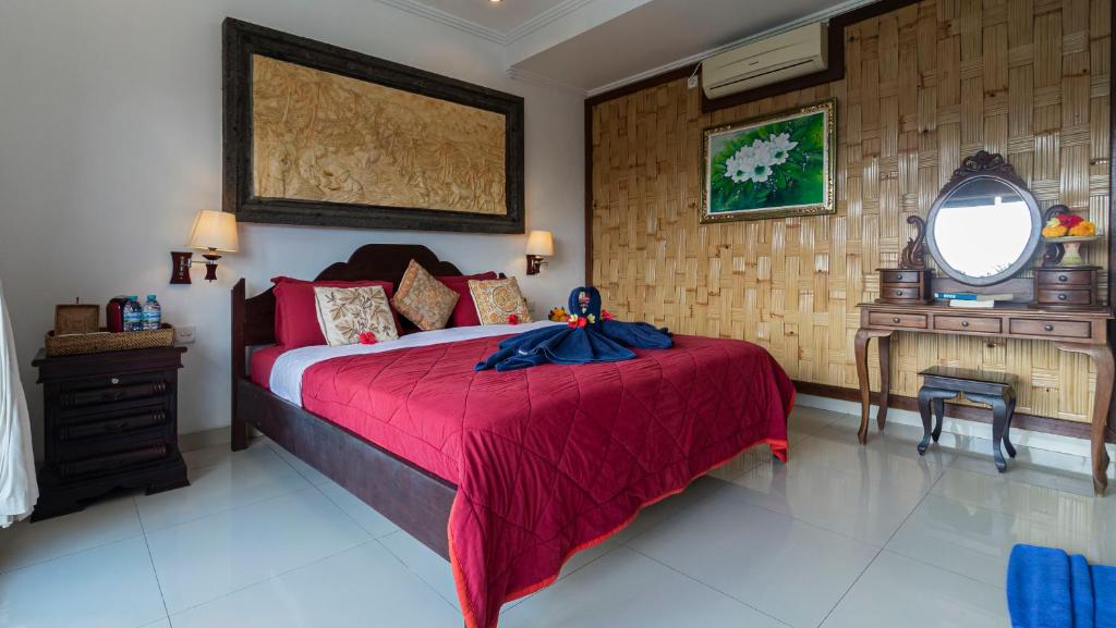 Postel nebo postele na pokoji v ubytování Kun - Kun Guest House Ubud