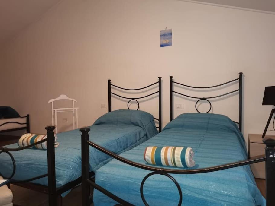 A bed or beds in a room at Casa della nonna