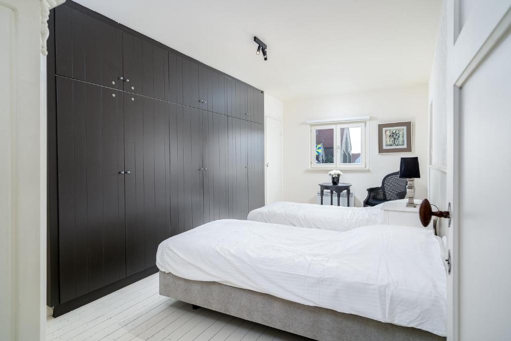 Postel nebo postele na pokoji v ubytování CAPRINO Guesthouse