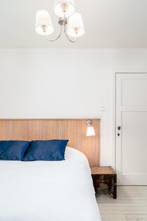Postel nebo postele na pokoji v ubytování CAPRINO Guesthouse
