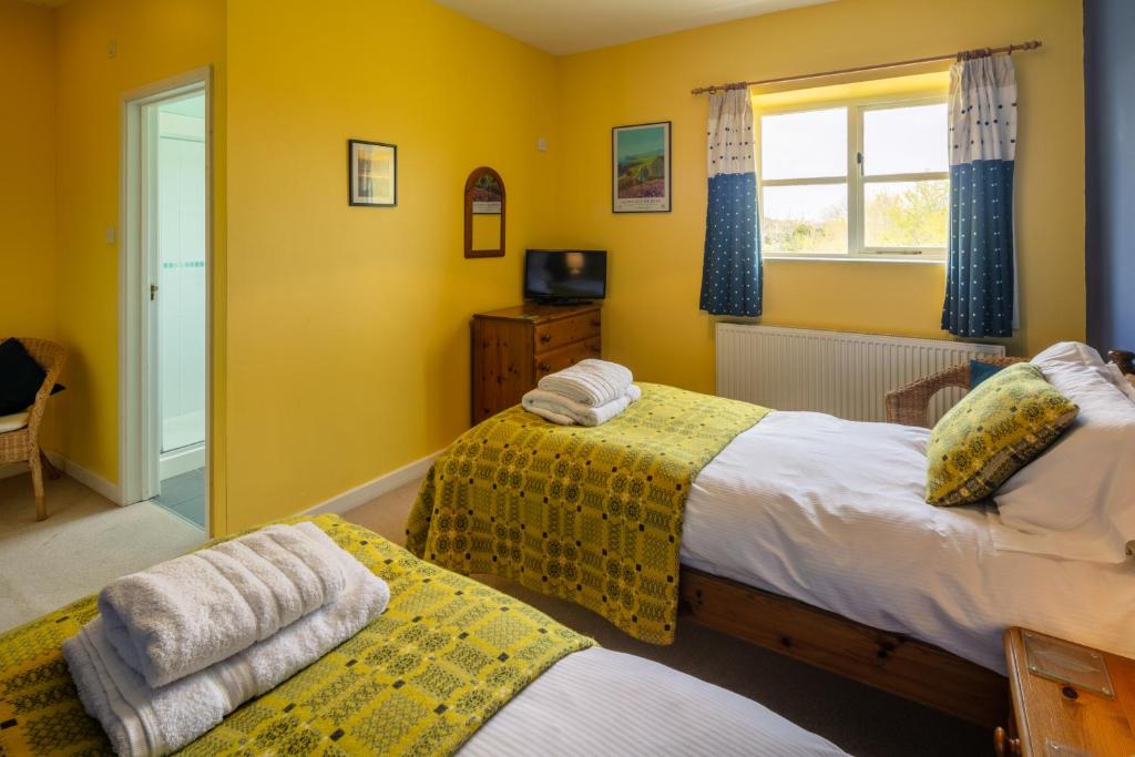 Кровать или кровати в номере East Trewent Farm