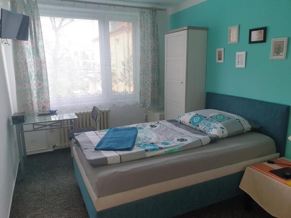 Postel nebo postele na pokoji v ubytování Pension Beránek