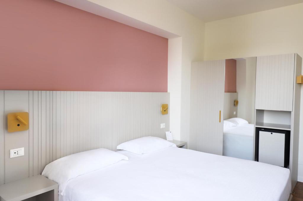 Postel nebo postele na pokoji v ubytování Hotel Fonte Boiola