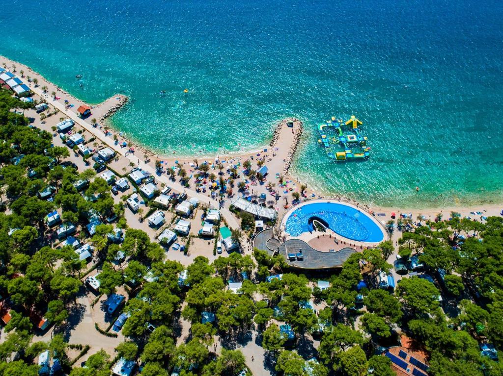 an overhead view of a beach with a group of people at Amadria Park Camping Sibenik Mobile Homes in Šibenik