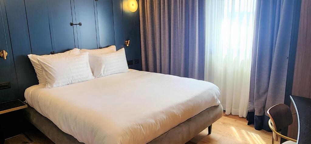 Postel nebo postele na pokoji v ubytování SeaNet Hotel By AFI Hotels