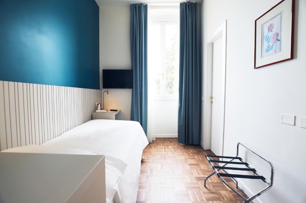 Postel nebo postele na pokoji v ubytování Hotel Fonte Boiola