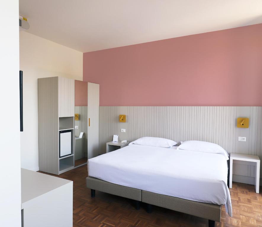 Postel nebo postele na pokoji v ubytování Hotel Fonte Boiola