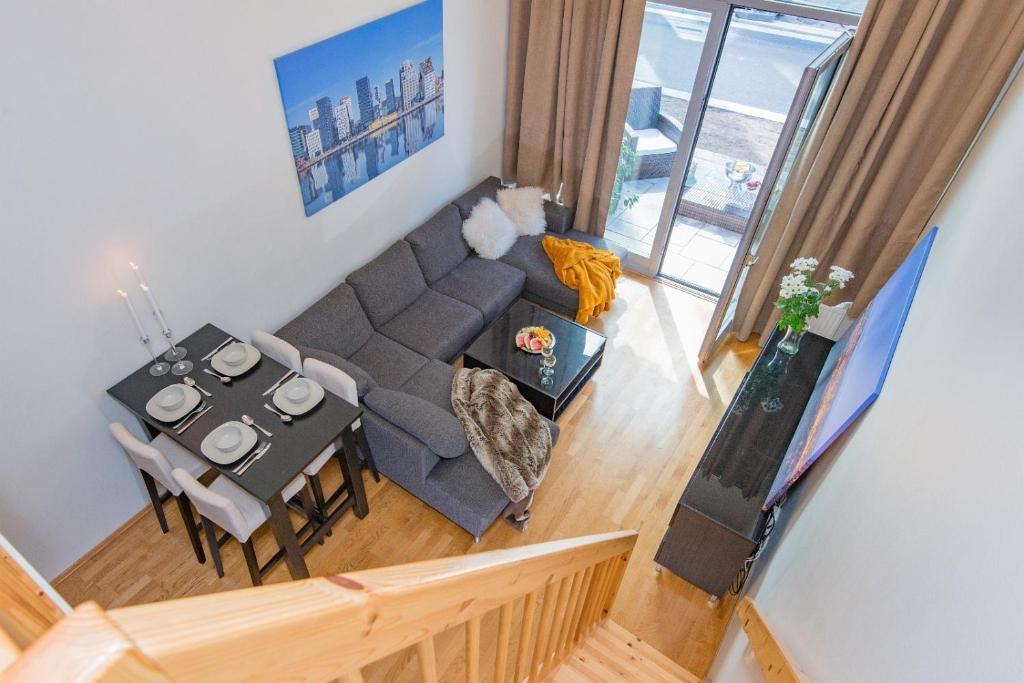 an overhead view of a living room with a couch and a table at Super central - Unique studio apartment - 4 people in Oslo
