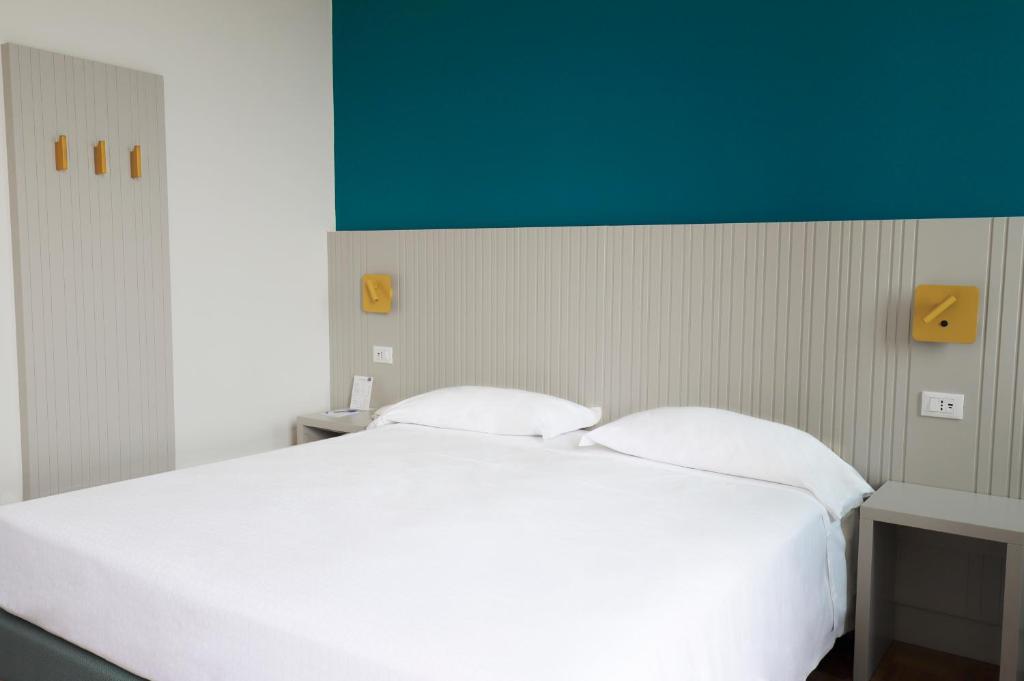 Postel nebo postele na pokoji v ubytování Hotel Fonte Boiola