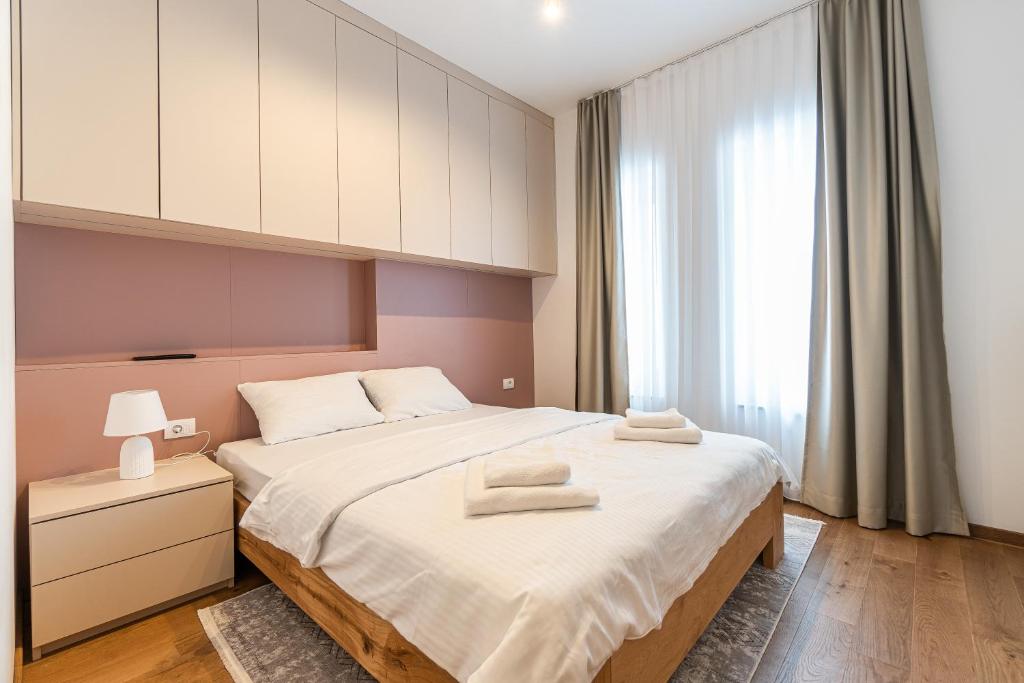Postel nebo postele na pokoji v ubytování Aparthotel RAJSKA