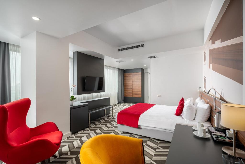 Postel nebo postele na pokoji v ubytování Mercure Bucharest Unirii