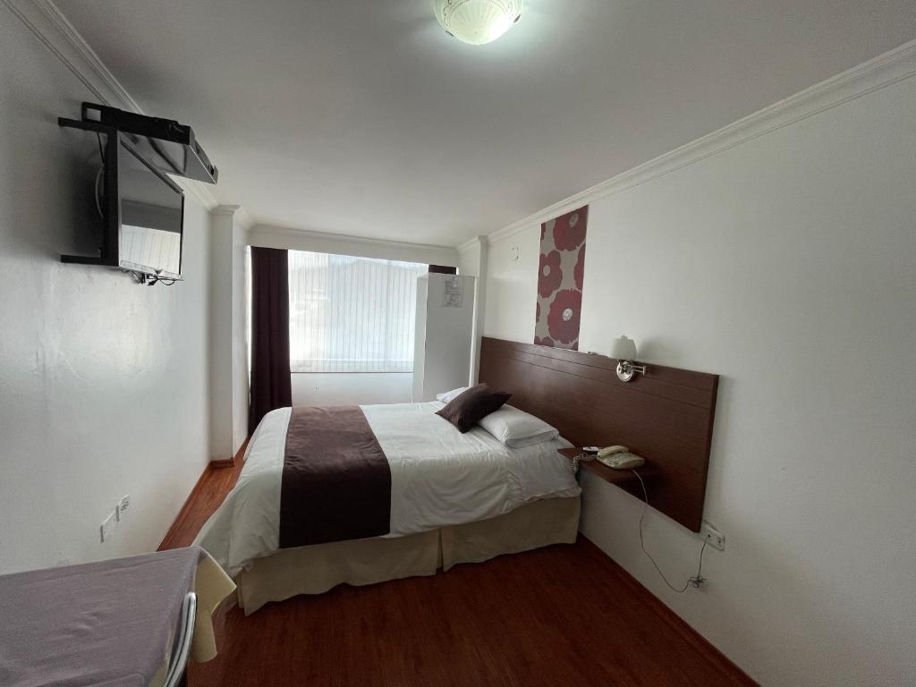 Postel nebo postele na pokoji v ubytování Gran Hotel Napoleón