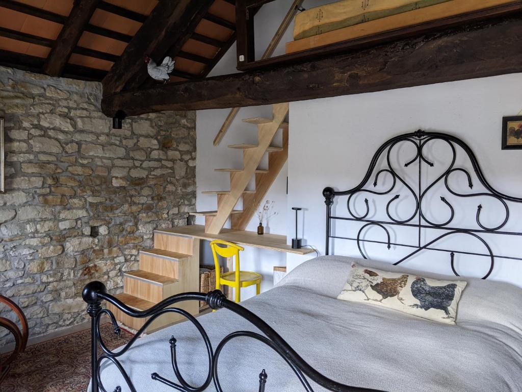 A bed or beds in a room at Country old stone house immerse in nature