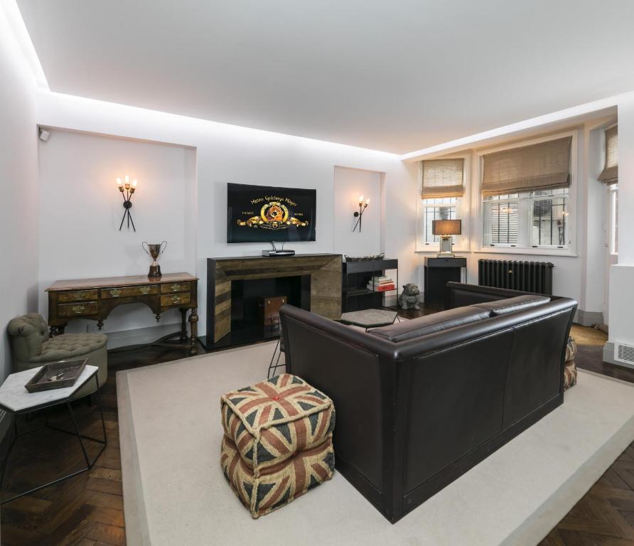 a living room with a pool table at The Marlborough Suite in London