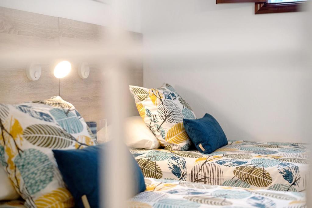 A bed or beds in a room at Casa Playa Palmeras