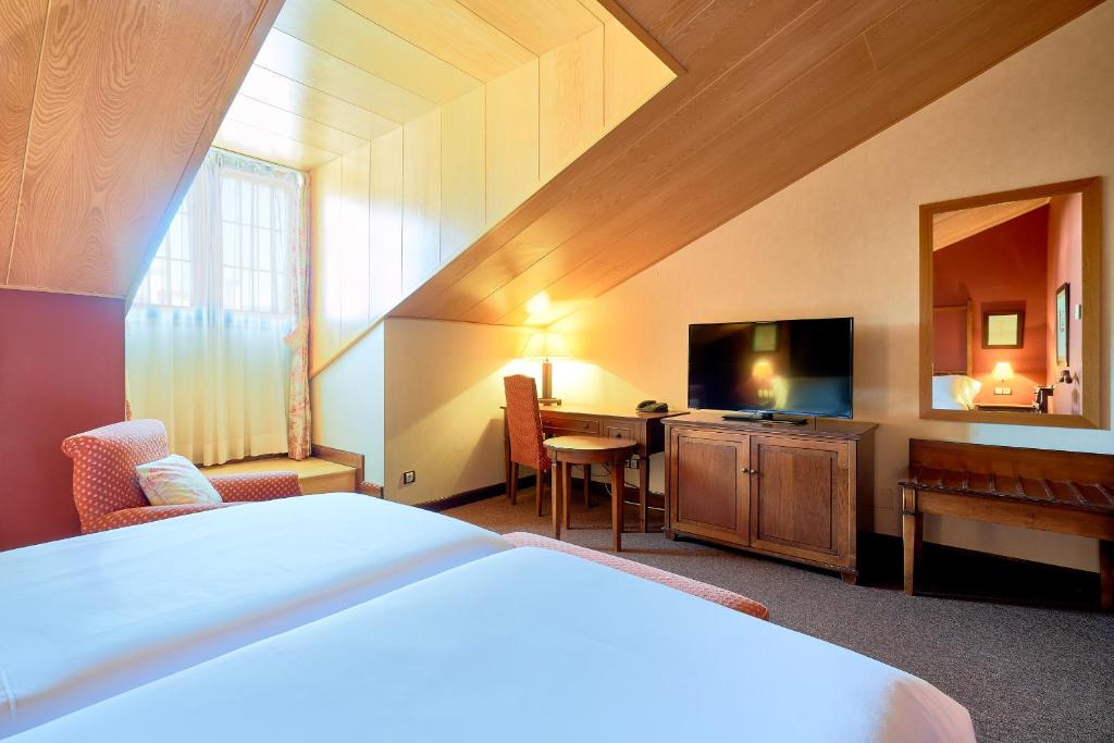 Cama o camas de una habitación en Hotel Fontecruz Ávila
