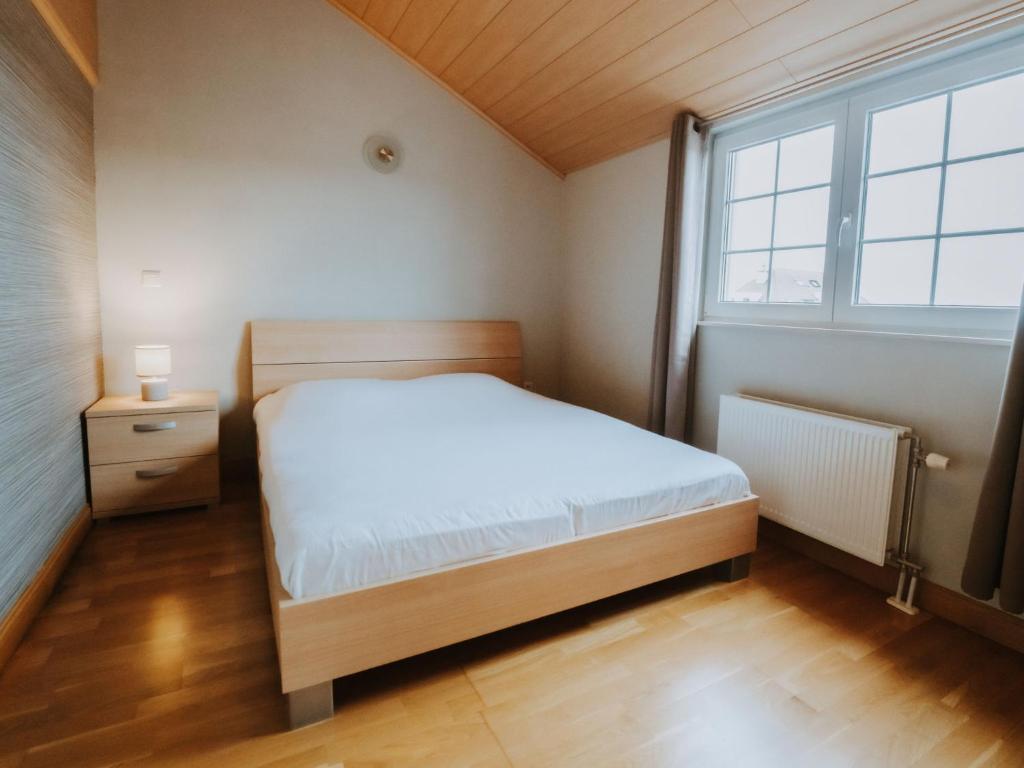 Postel nebo postele na pokoji v ubytování Apartment The Horseshoe by Interhome