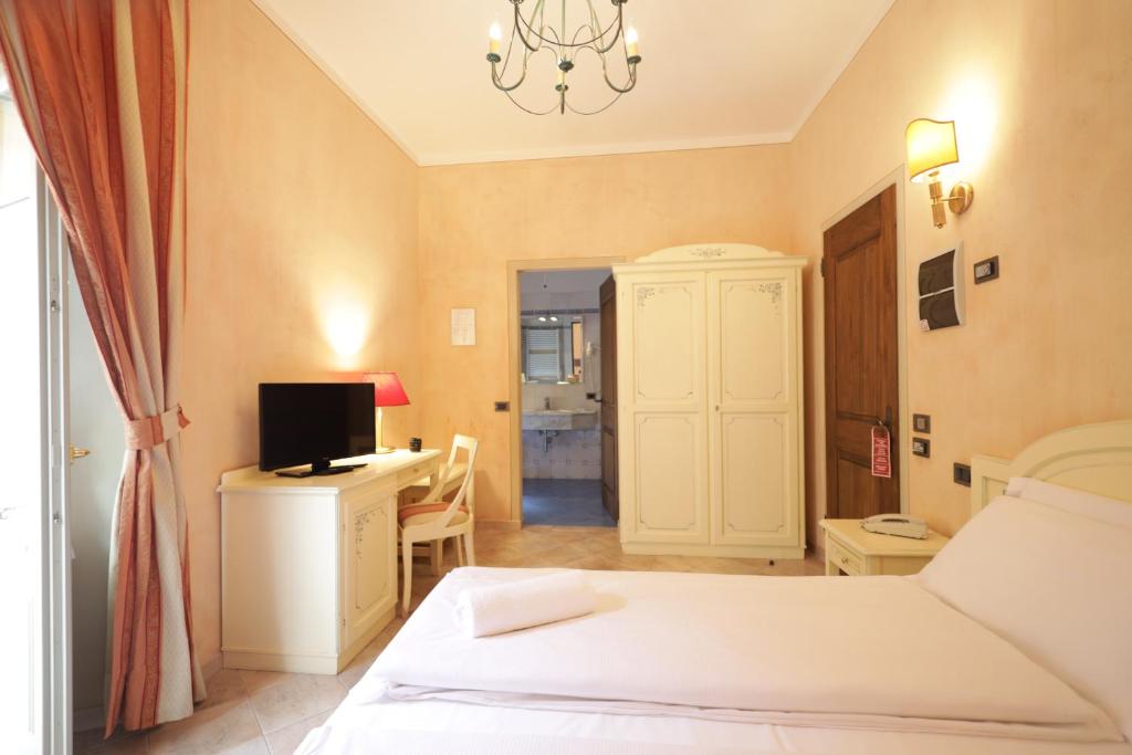 Postel nebo postele na pokoji v ubytování Hotel Il Portico by LVG Hotel Collection