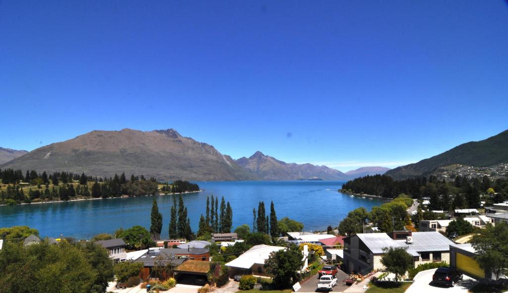 a view of a town next to a lake at Earnslaw Lodge in Queenstown