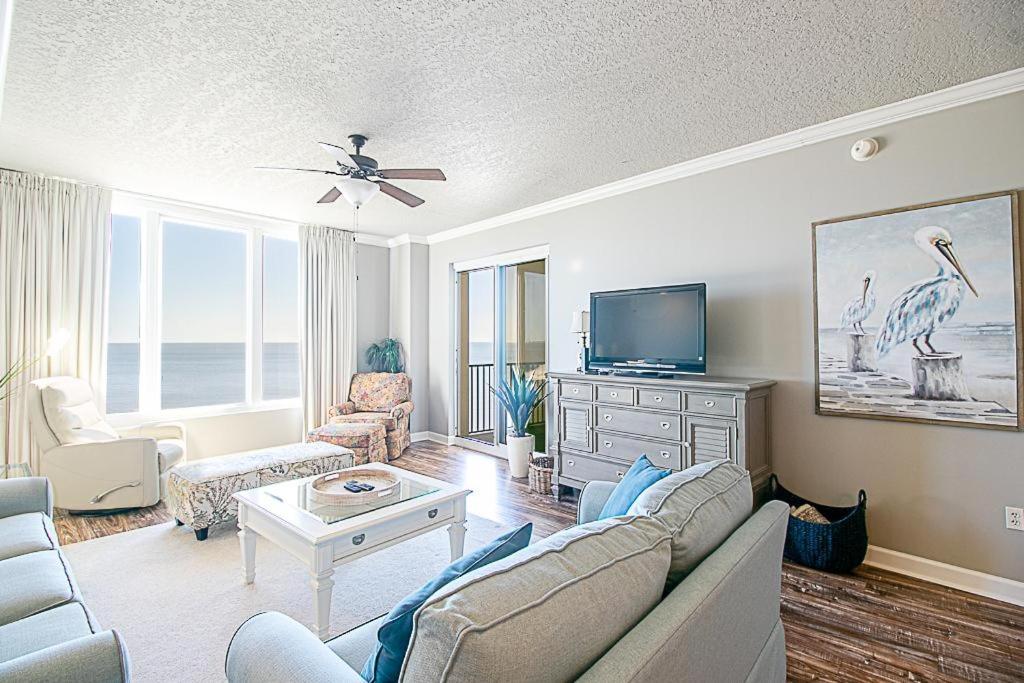 a living room with a couch and a tv at Sienna 1103 in Gulfport