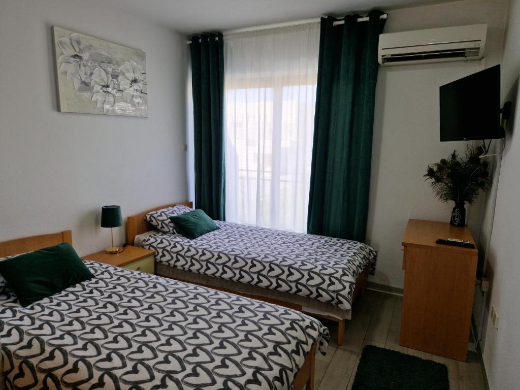 Postel nebo postele na pokoji v ubytování Motel "Tri lovca"