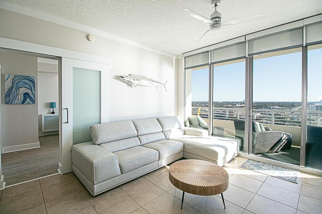 a living room with a white couch and a table at Ocean Club 1206 in Biloxi