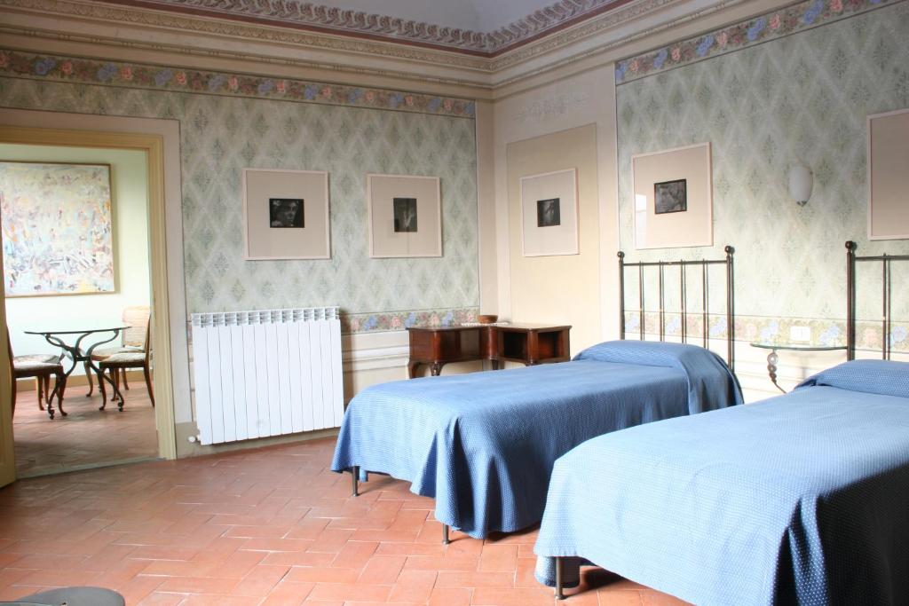 Postel nebo postele na pokoji v ubytování Albergo San Lorenzo