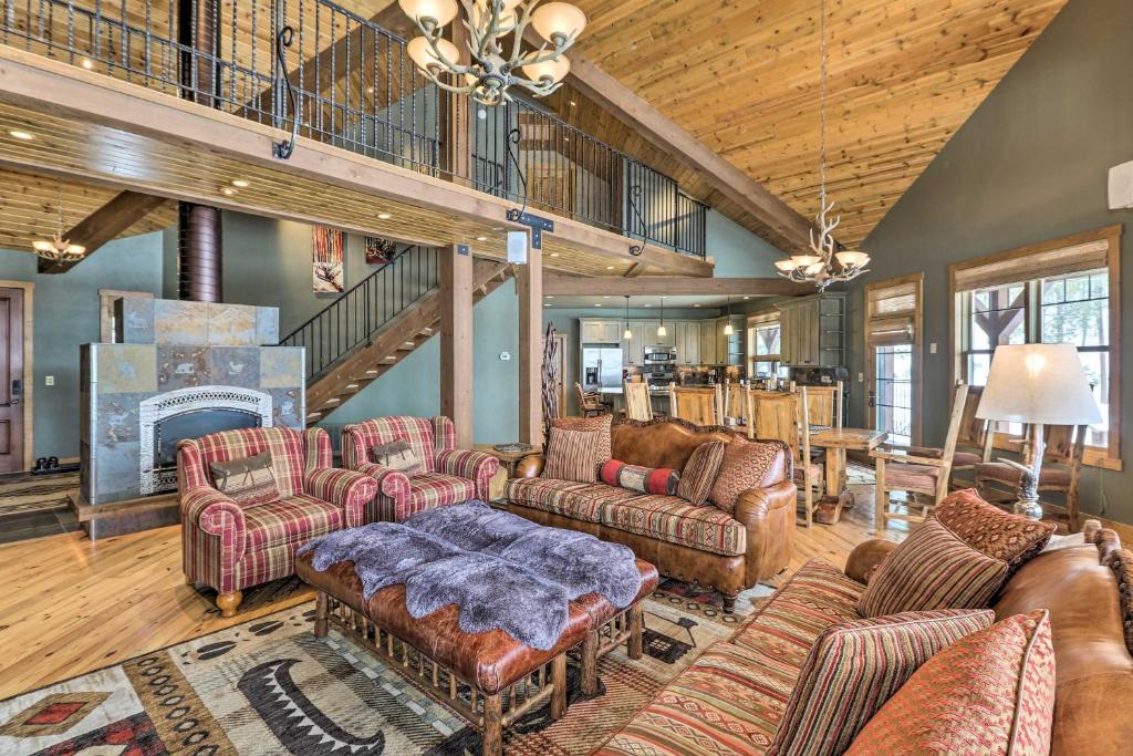 a large living room with couches and a fireplace at Beautiful Eureka Cabin Rental on Golf Resort! in Eureka
