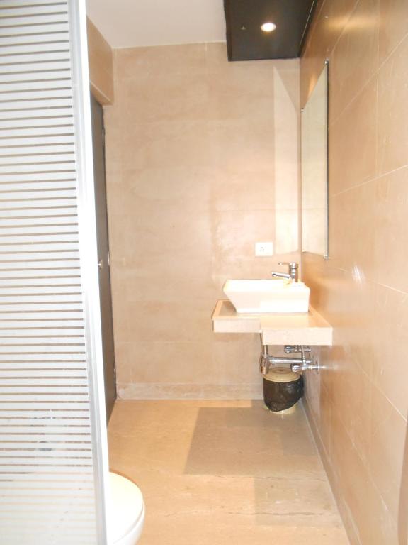 Koupelna v ubytování Hotel Aston International