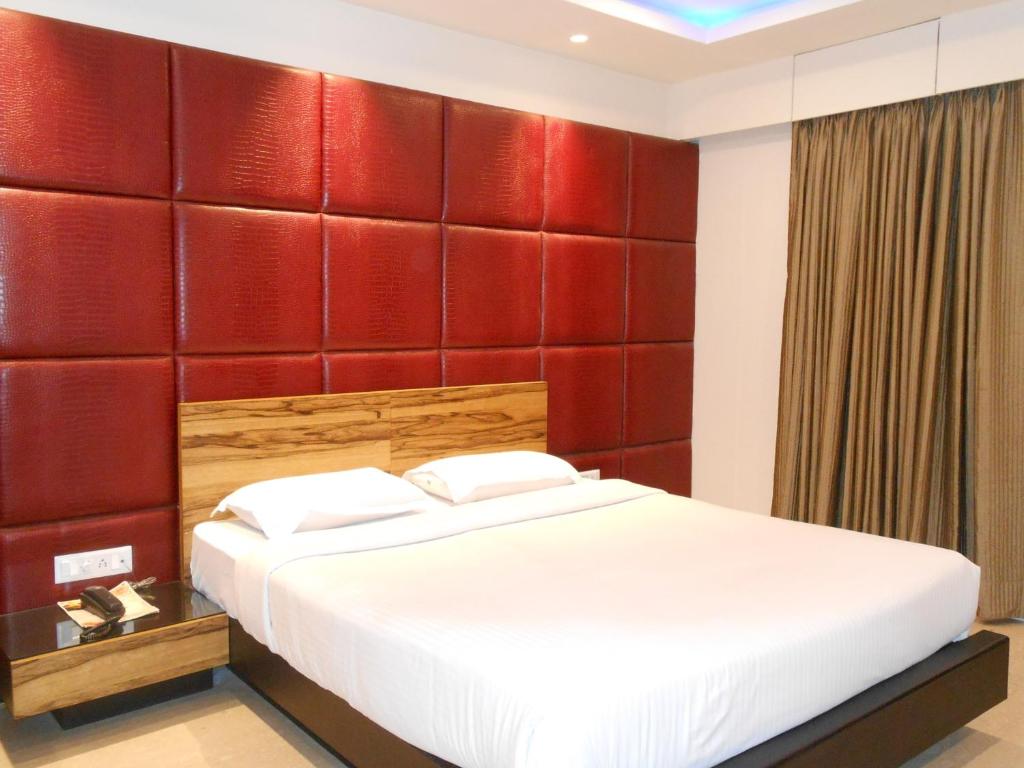 Postel nebo postele na pokoji v ubytování Hotel Aston International