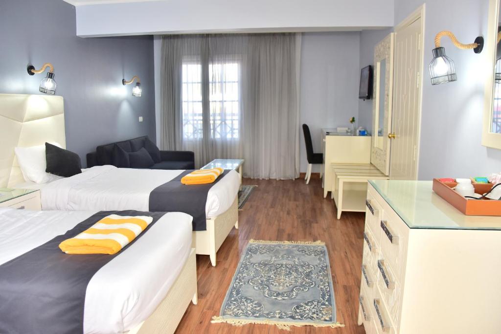 Postel nebo postele na pokoji v ubytování Verginia Sharm Resort & Aqua Park