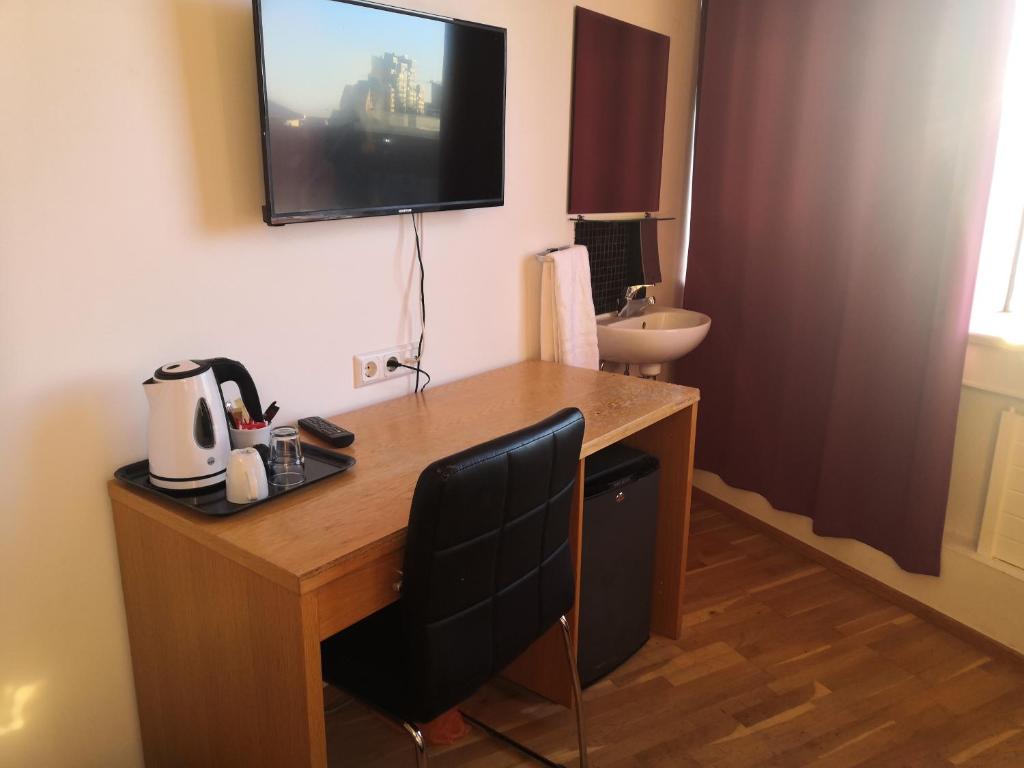 TV o dispositivi per l'intrattenimento presso 101 Guesthouse Hotel