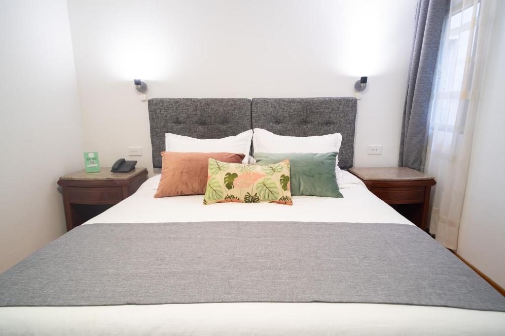 Postel nebo postele na pokoji v ubytování Hotel Virrey Central