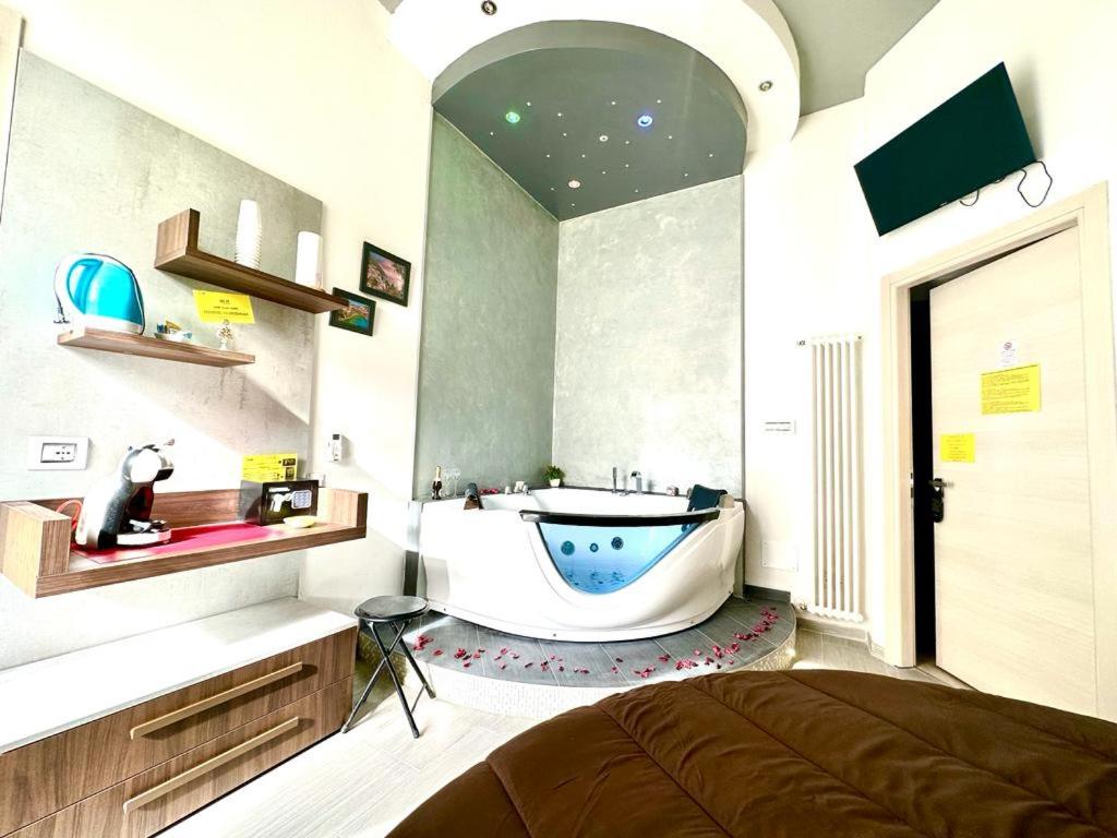 TV a/nebo společenská místnost v ubytování Il Quadrifoglio guesthouse
