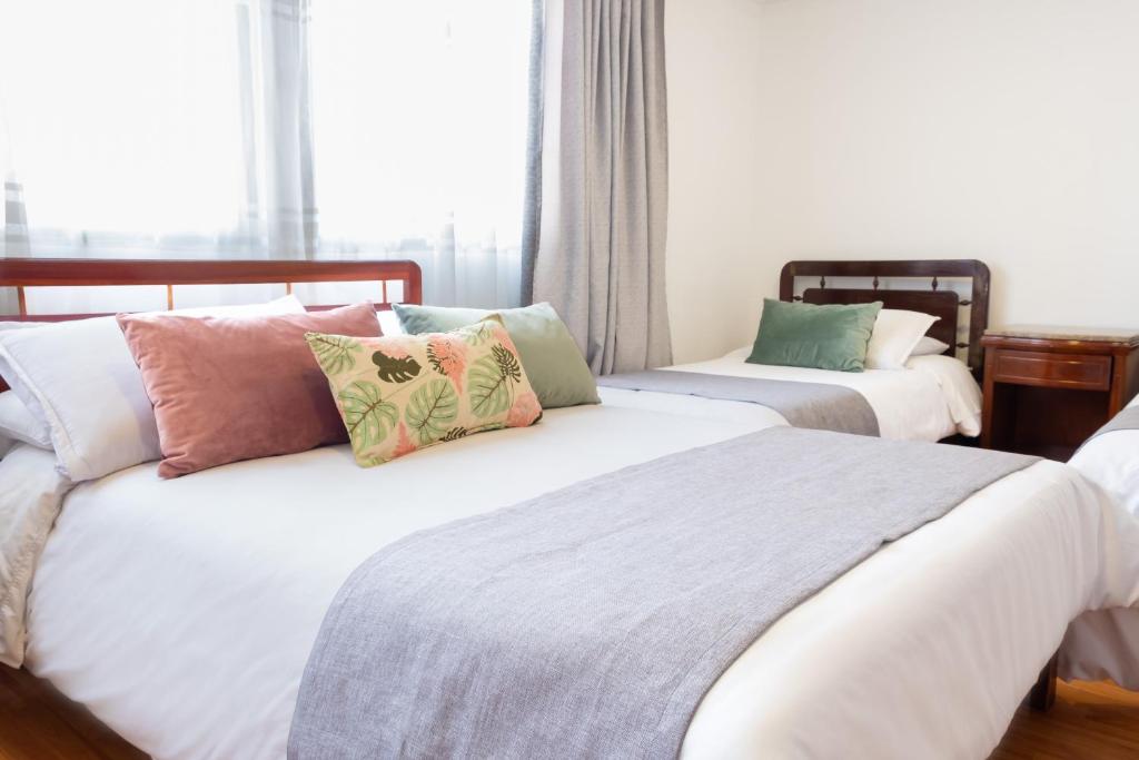 Postel nebo postele na pokoji v ubytování Hotel Virrey Central