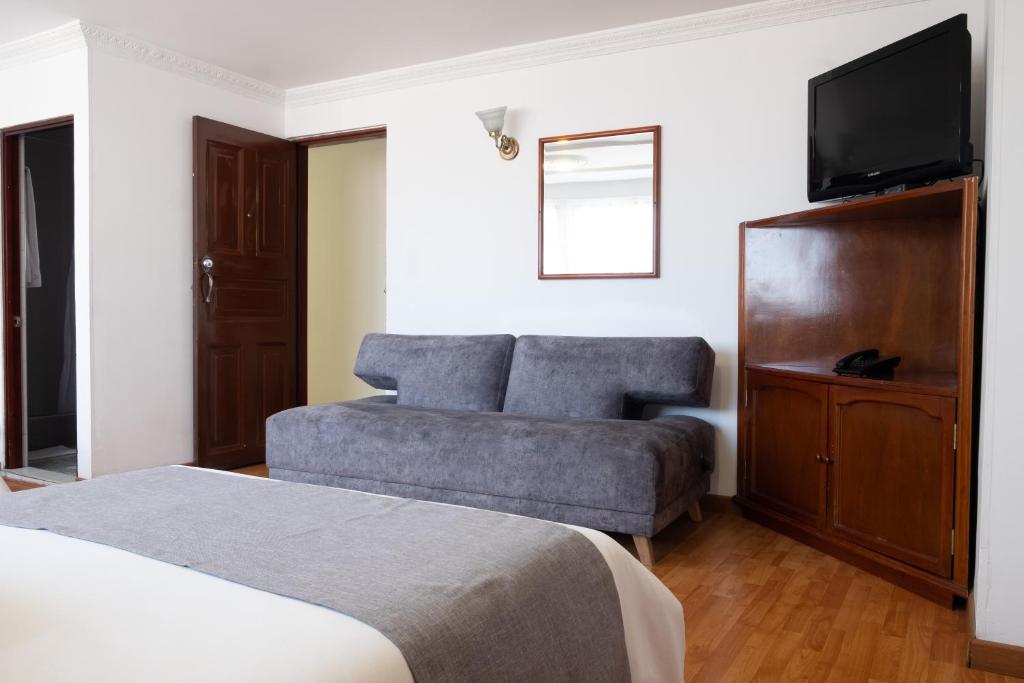 Postel nebo postele na pokoji v ubytování Hotel Virrey Central
