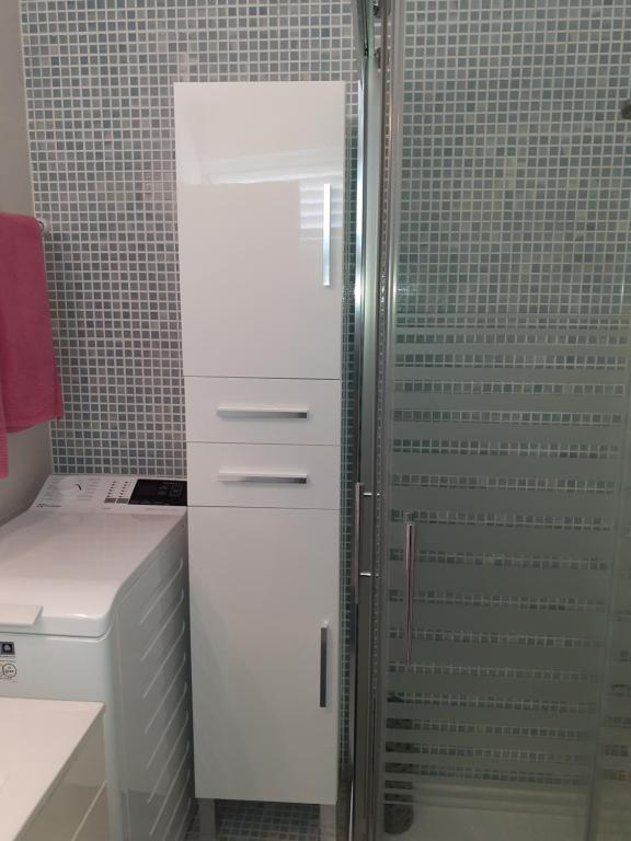 a shower in a bathroom with a glass door at Studio Ponderosa in Playa de las Americas