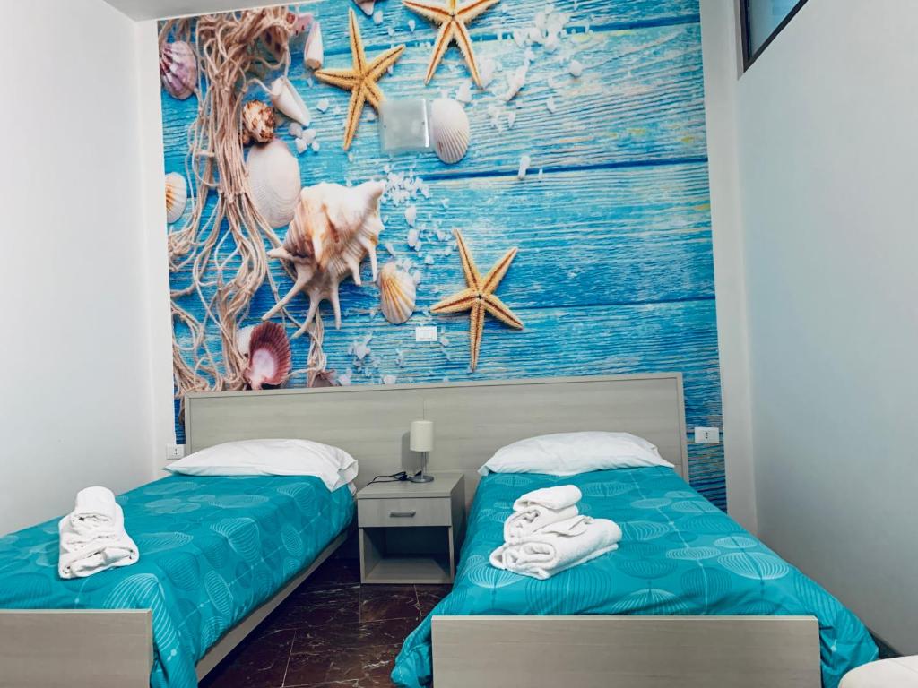 Postel nebo postele na pokoji v ubytování Residence R&B Tyrrhenum