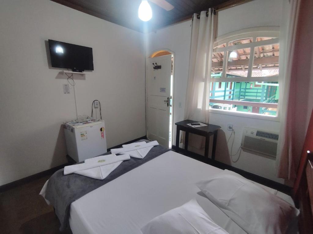 Postel nebo postele na pokoji v ubytování Pousada Taquinha Paraty - CENTRO