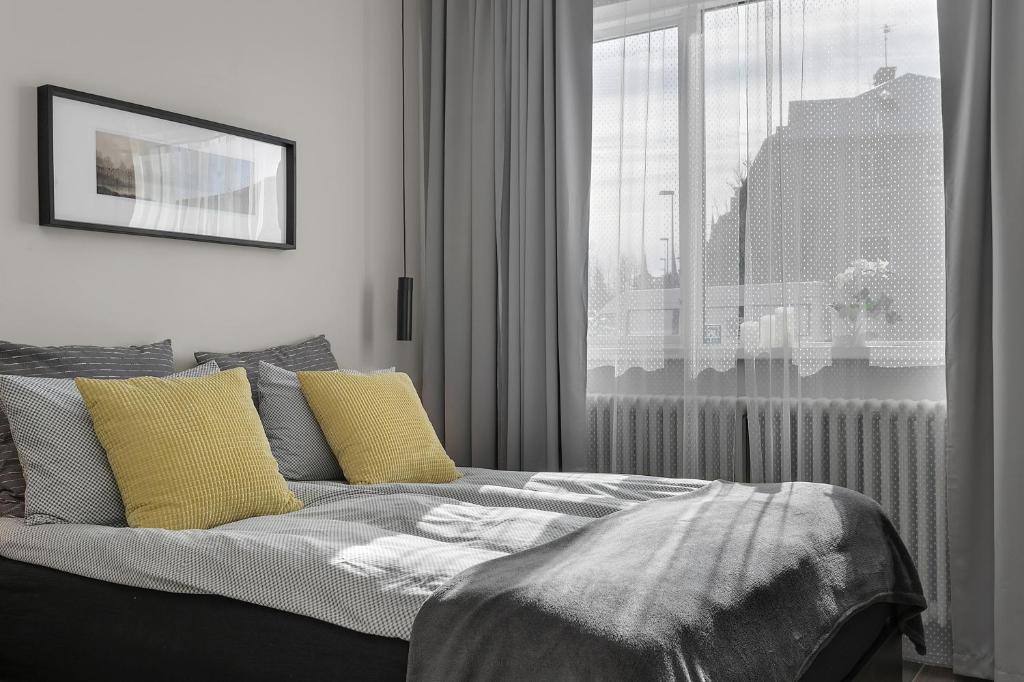Postel nebo postele na pokoji v ubytování NN Urban Guesthouse