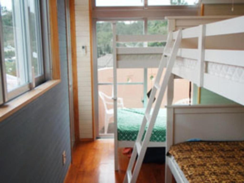 a bunk bed with a ladder in a room at Amakara okinawa - Vacation STAY 85528v in Yohena