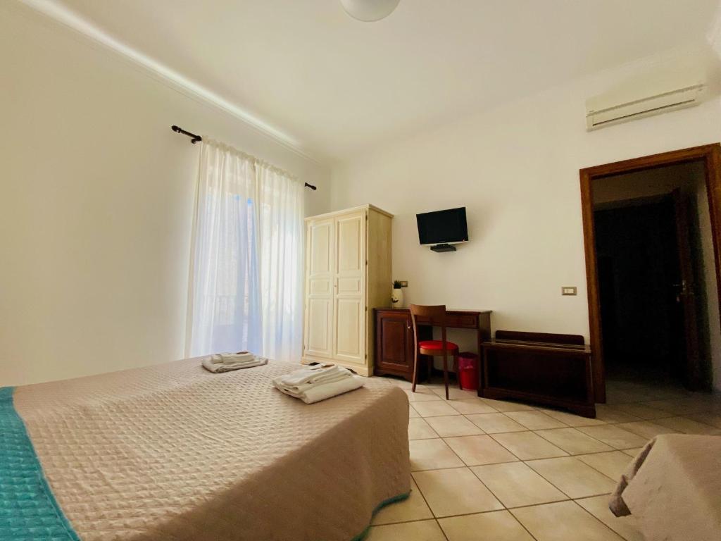 Posteľ alebo postele v izbe v ubytovaní Mamamia #Lipari