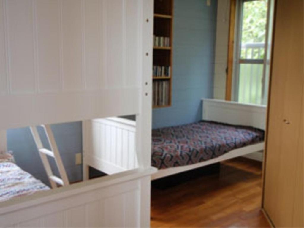 a bedroom with a bunk bed and a window at Amakara okinawa - Vacation STAY 85522v in Yohena