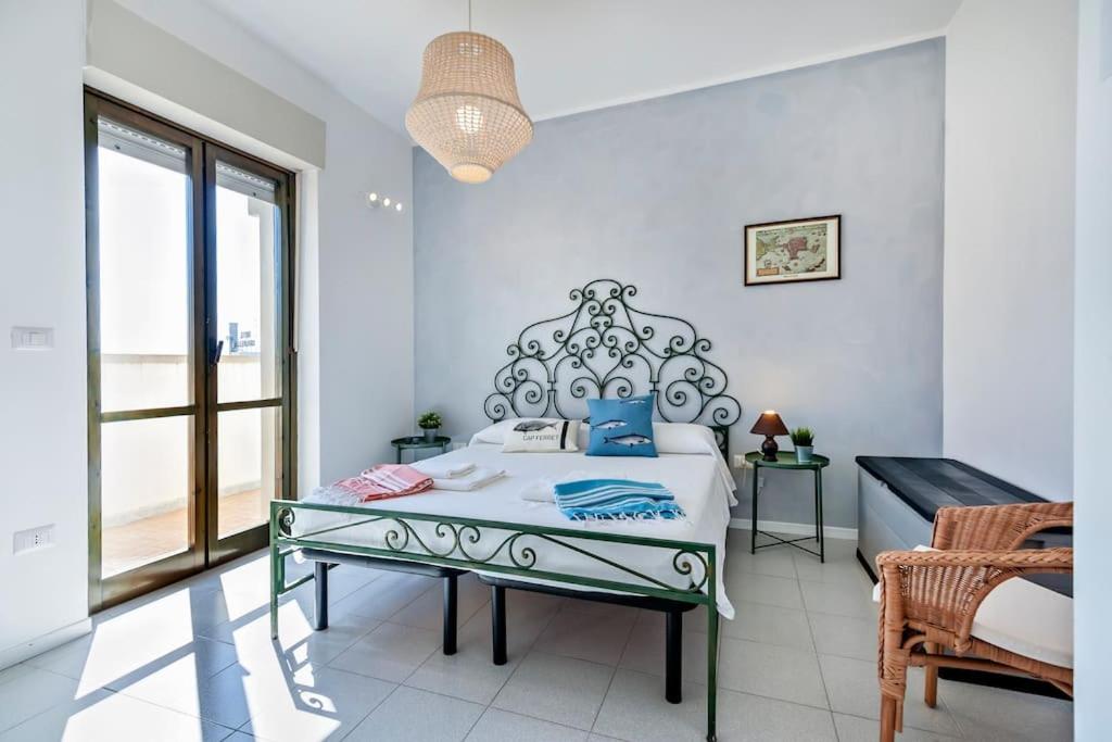 A bed or beds in a room at Cozy Flat and Terrace - 2 min from the beach by Sweet Home Puglia Apartments
