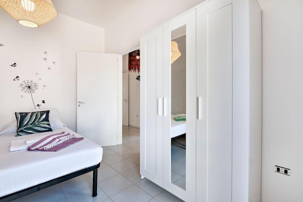 A bed or beds in a room at Cozy Flat and Terrace - 2 min from the beach by Sweet Home Puglia Apartments