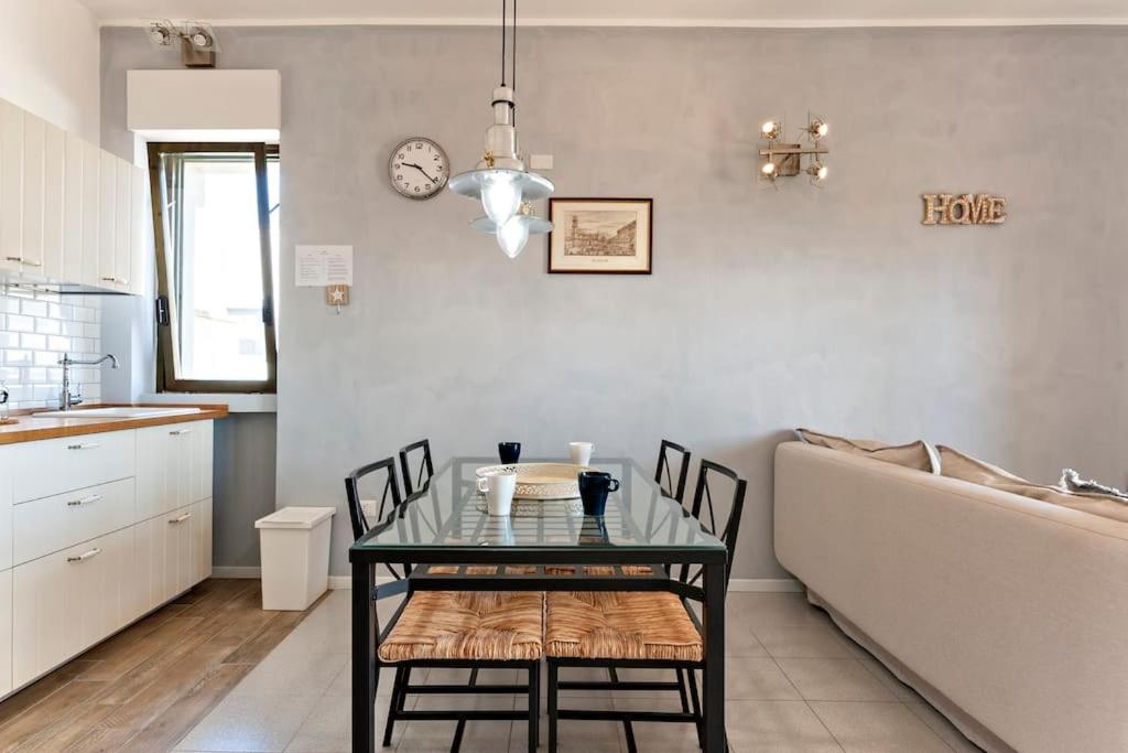 A kitchen or kitchenette at Cozy Flat and Terrace - 2 min from the beach by Sweet Home Puglia Apartments