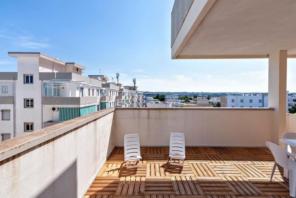 A balcony or terrace at Cozy Flat and Terrace - 2 min from the beach by Sweet Home Puglia Apartments
