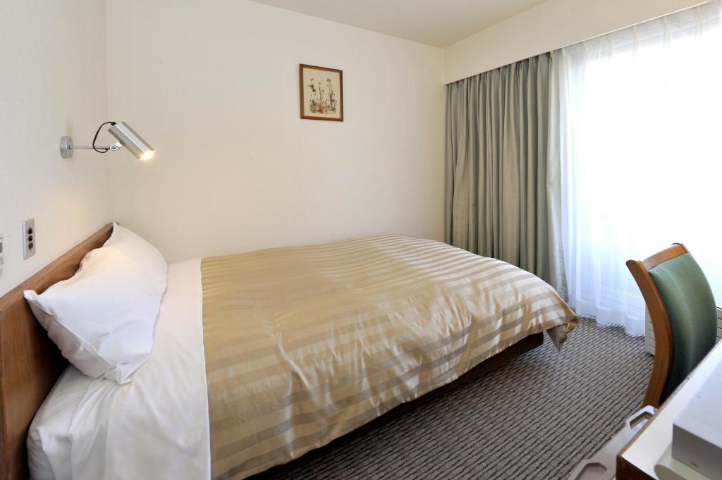 Postel nebo postele na pokoji v ubytování Hotel Gimmond Kyoto