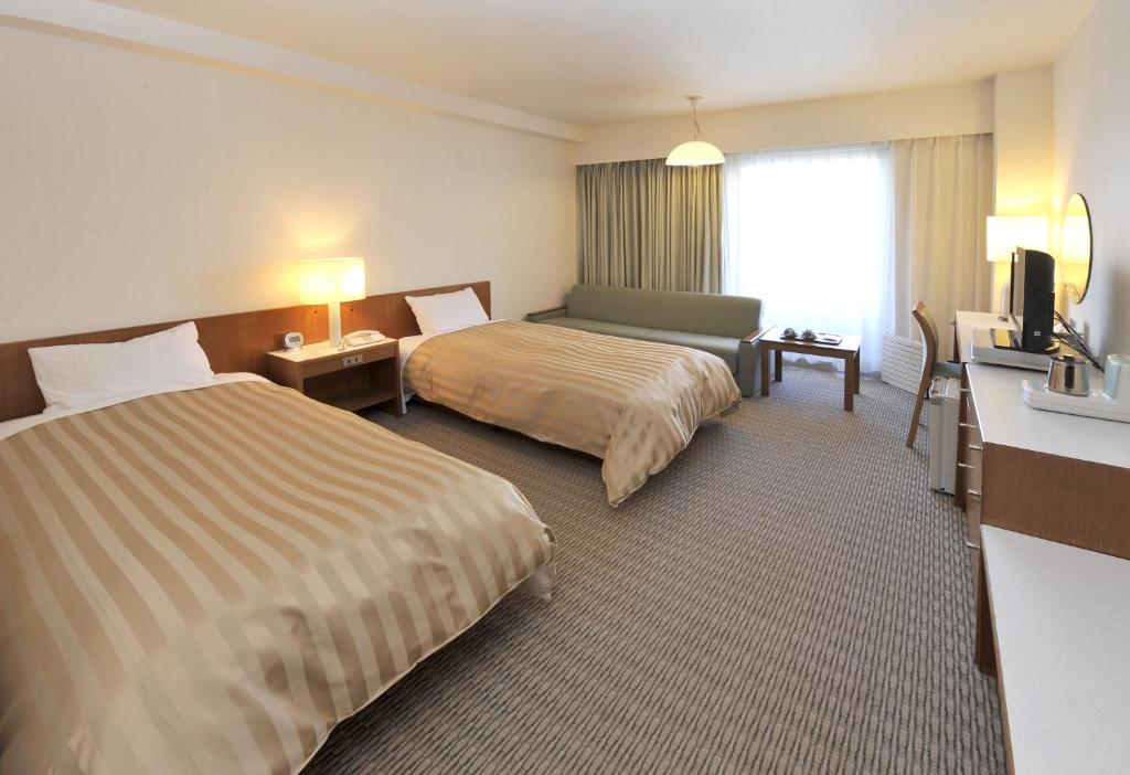 Postel nebo postele na pokoji v ubytování Hotel Gimmond Kyoto