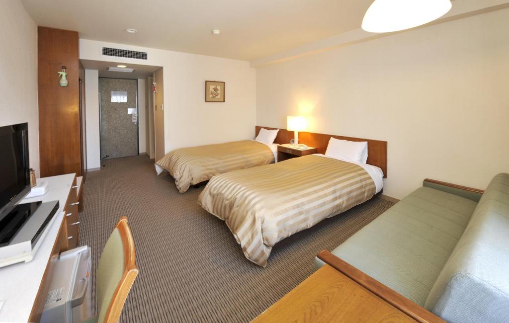 Postel nebo postele na pokoji v ubytování Hotel Gimmond Kyoto